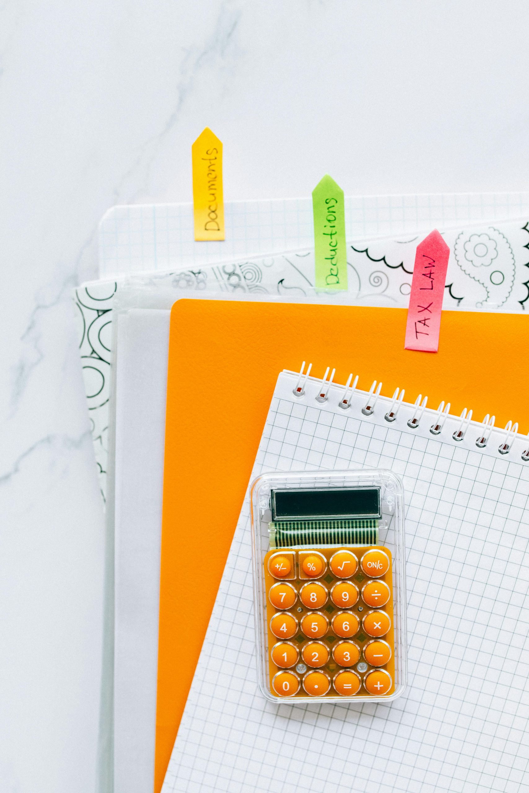 Bright stationery setup featuring a calculator and documents for efficient bookkeeping.